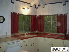 18330 Bessbrook Road Charlotte, NC 28278 - Photo 5 of 8 a bathroom with a sink and a mirror