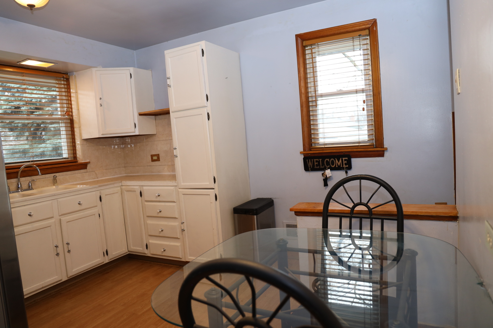 4641 Butterfield Road Hillside, IL 60162 - Photo 13 of 57 a kitchen with a stove a sink and a window