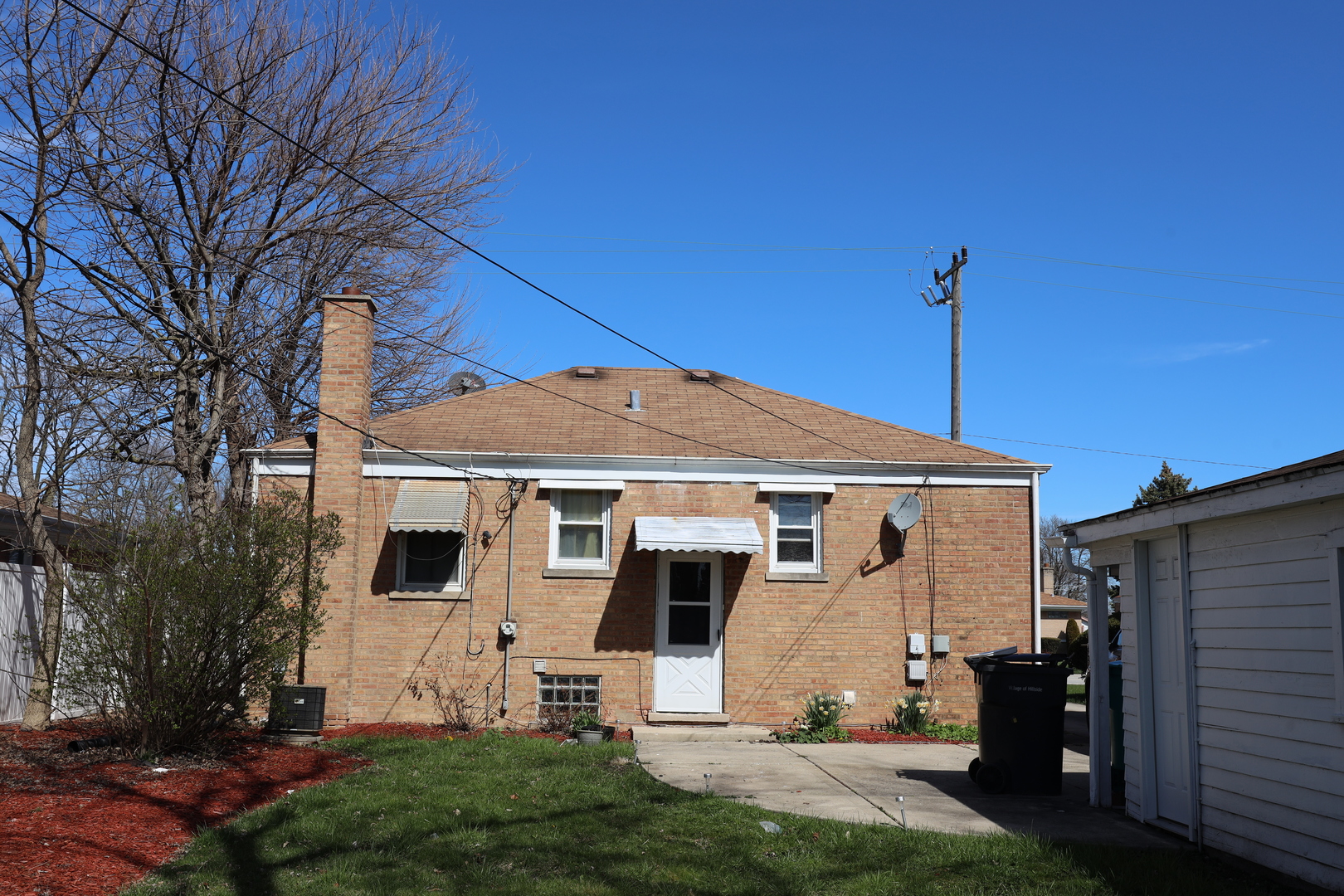 4641 Butterfield Road Hillside, IL 60162 - Photo 24 of 57 a front view of a house with a yard
