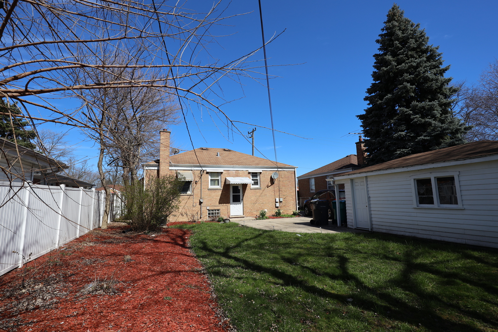 4641 Butterfield Road Hillside, IL 60162 - Photo 25 of 57 a front view of a house with garden