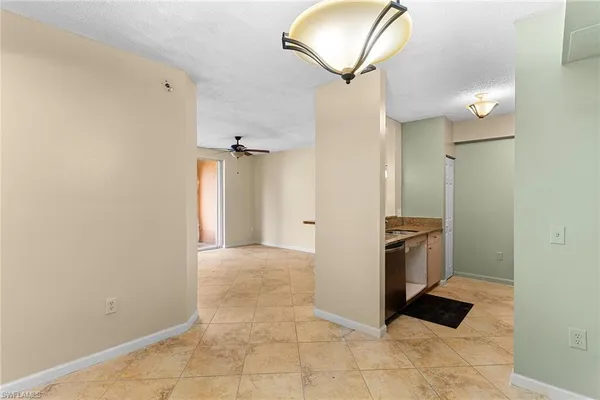 a kitchen with a refrigerator and a sink