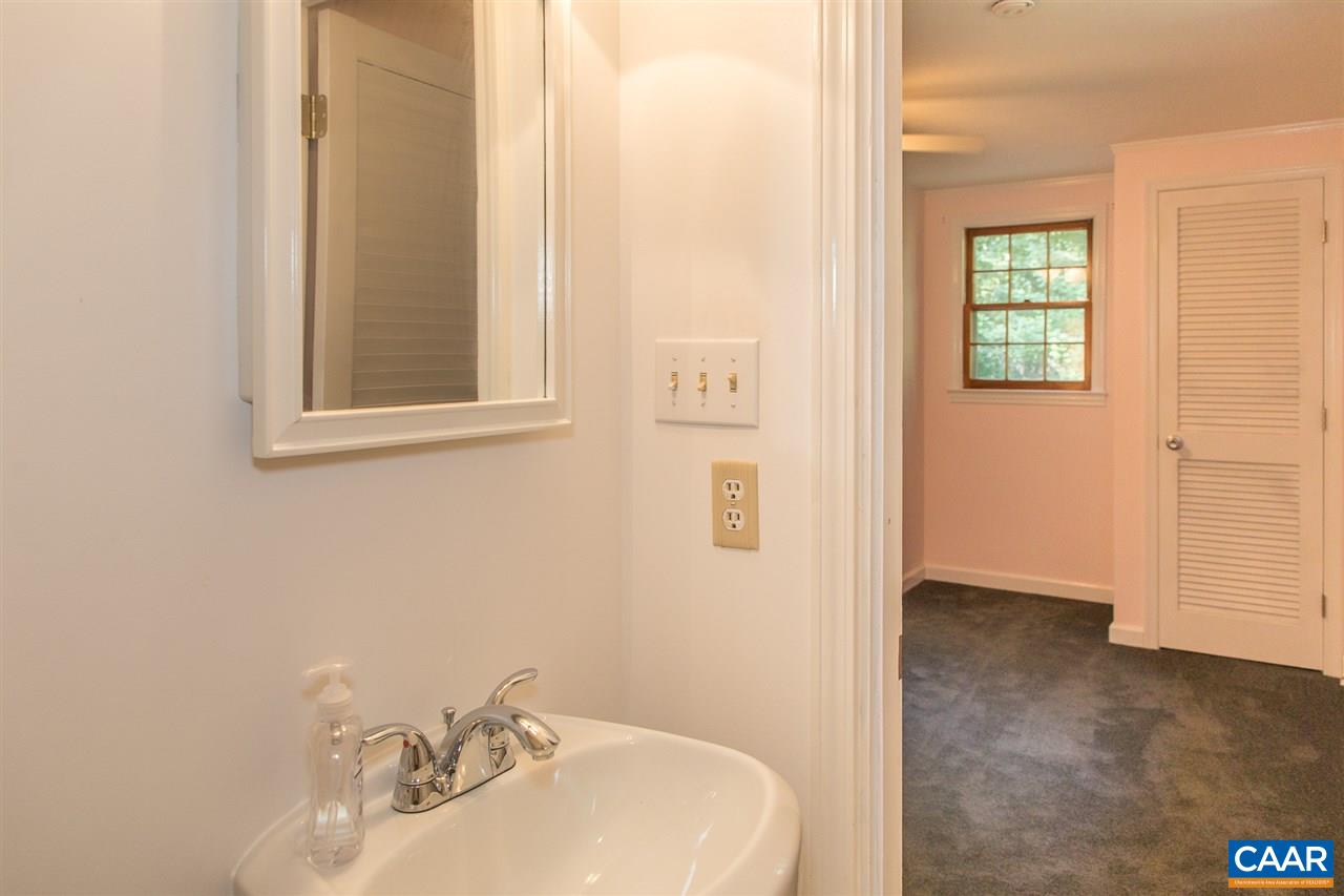 824 Dry Bridge Road Charlottesville, VA 22903 - Photo 23 of 43 a bathroom with a sink and a mirror