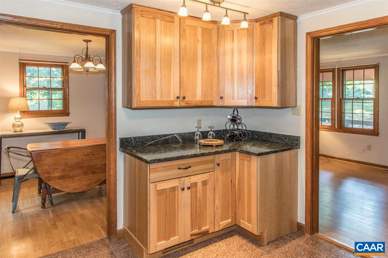 824 Dry Bridge Road Charlottesville, VA 22903 - Photo 10 of 43 a kitchen with granite countertop sink and cabinets