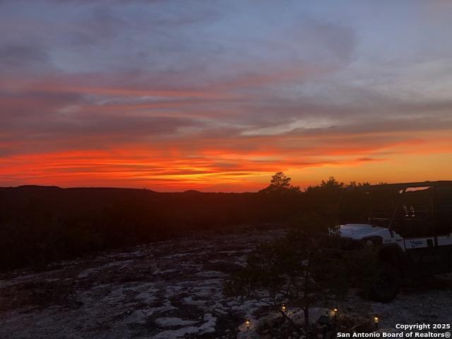 a view of sunset and yard