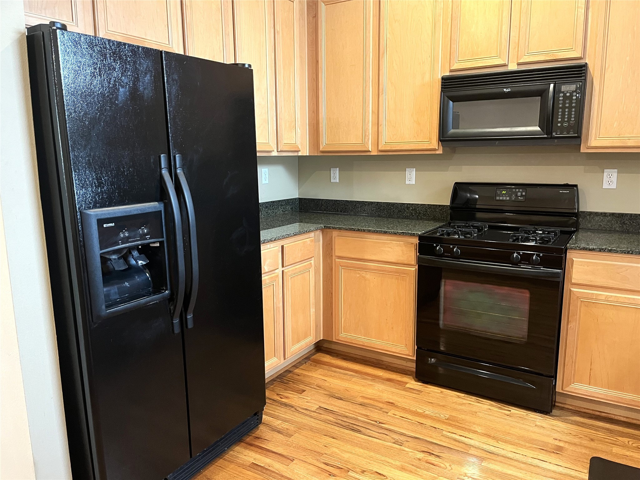 4338 Center Street Houston, TX 77007 - Photo 12 of 23 a kitchen with stainless steel appliances granite countertop a refrigerator and a stove top oven
