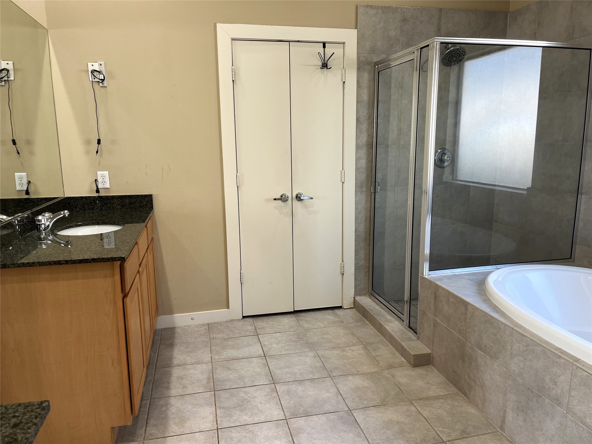 4338 Center Street Houston, TX 77007 - Photo 19 of 23 a bathroom with a granite countertop sink a toilet and shower