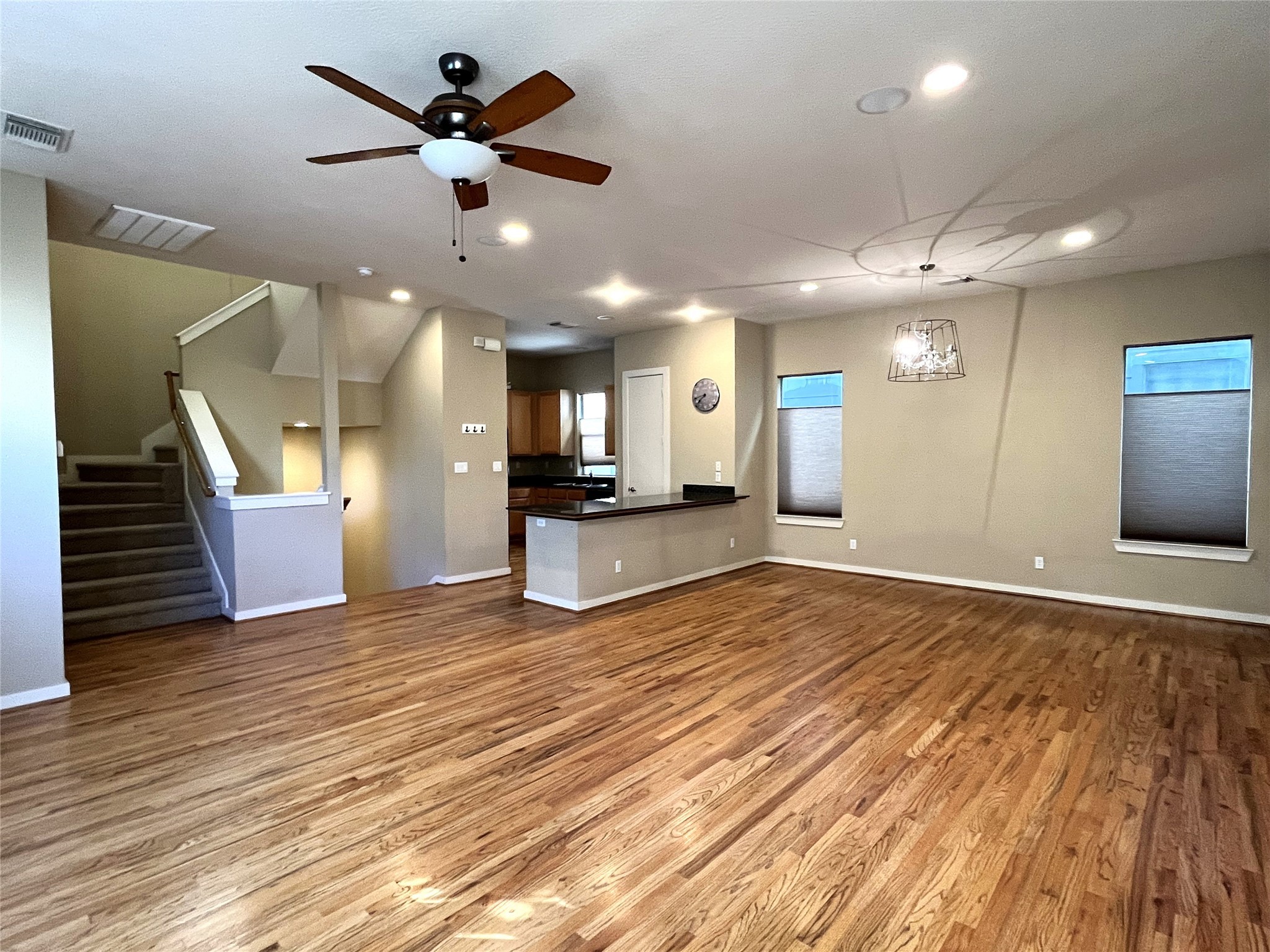 4338 Center Street Houston, TX 77007 - Photo 9 of 23 a view of an empty room and kitchen with wooden floor
