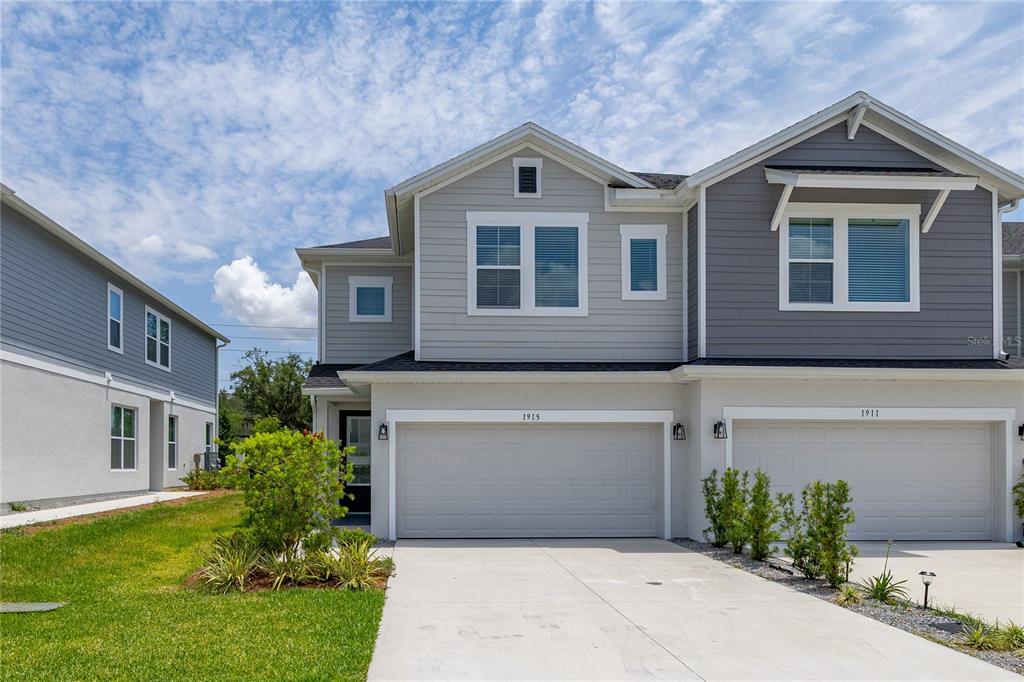 1915 Terrapin Road Ocoee, FL 34761 - Photo 1 of 1 a front view of house with yard and trees in the background
