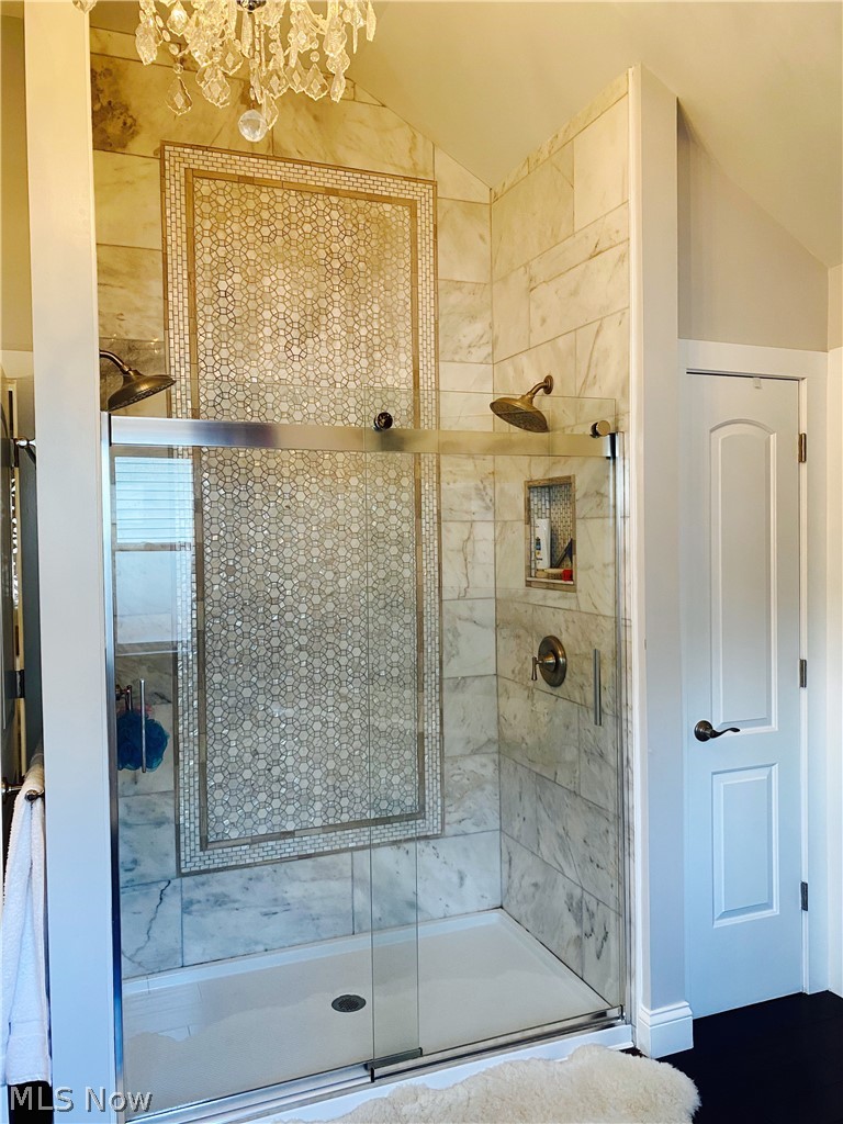 3626 Warren Road Cleveland, OH 44111 - Photo 15 of 34 10 foot double shower with marble and mother of pearl mosaics.