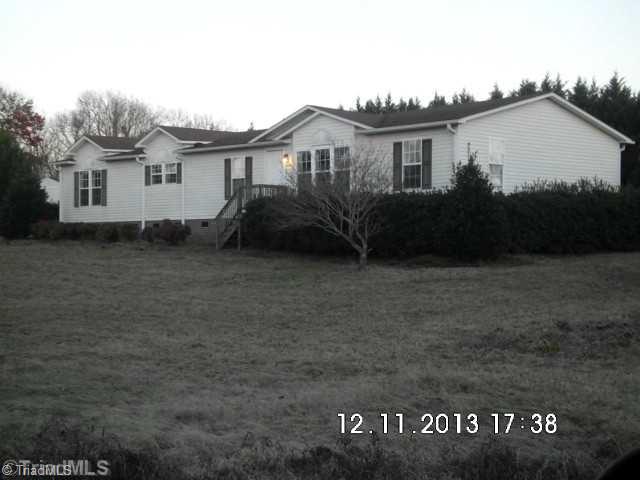 6915 Silver Springs Road Whitsett, NC 27377 - Photo 1 of 8 Exterior Front.