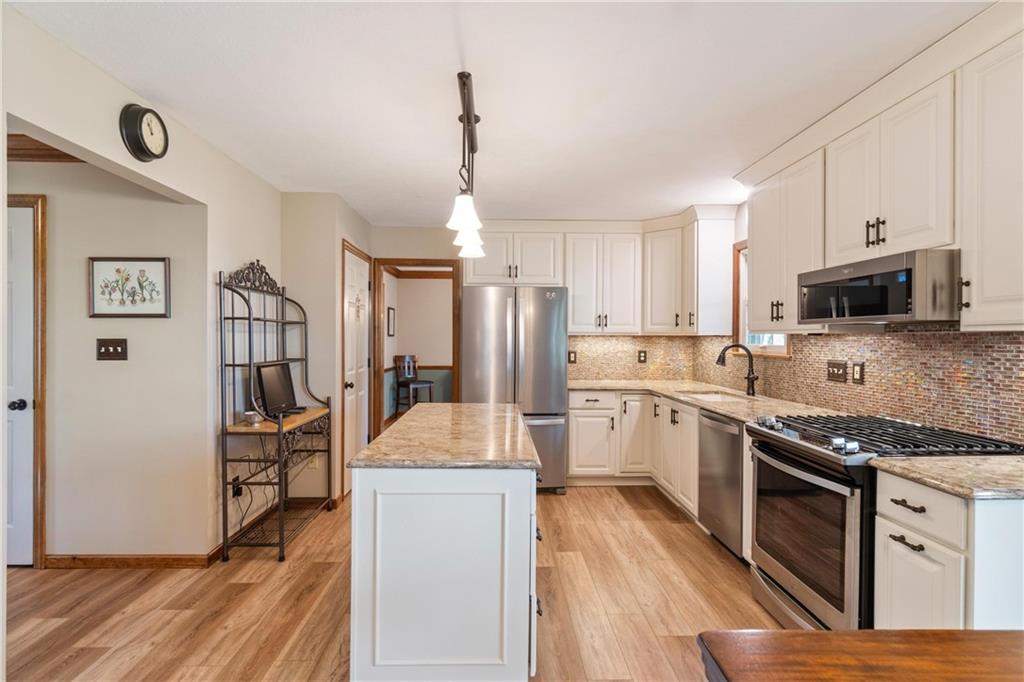 116 Firethorn Road Baden, PA 15005 - Photo 15 of 41 a kitchen with a sink stove and refrigerator