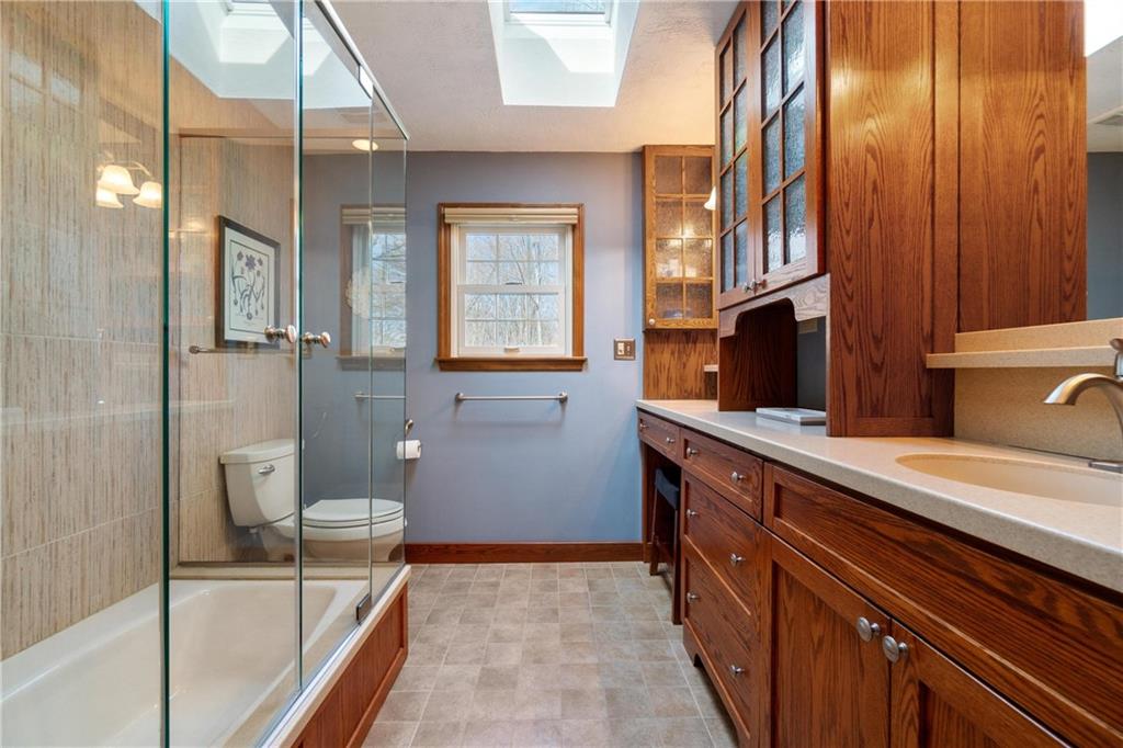 116 Firethorn Road Baden, PA 15005 - Photo 25 of 41 a spacious bathroom with a granite countertop sink a toilet and shower