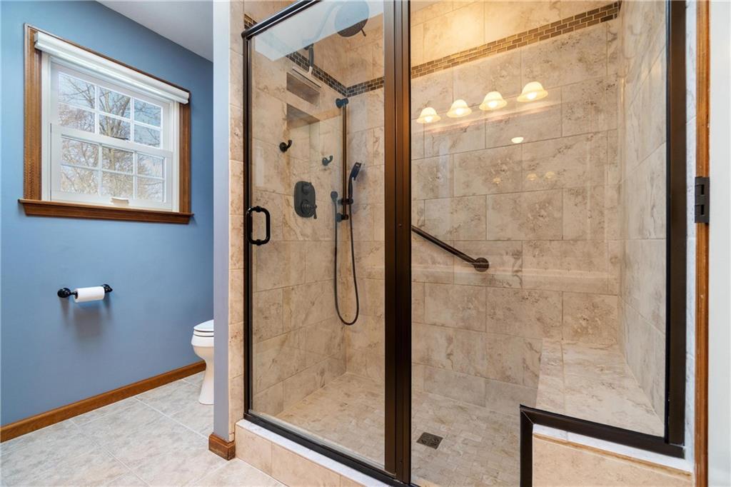 116 Firethorn Road Baden, PA 15005 - Photo 31 of 41 a bathroom with a glass shower door