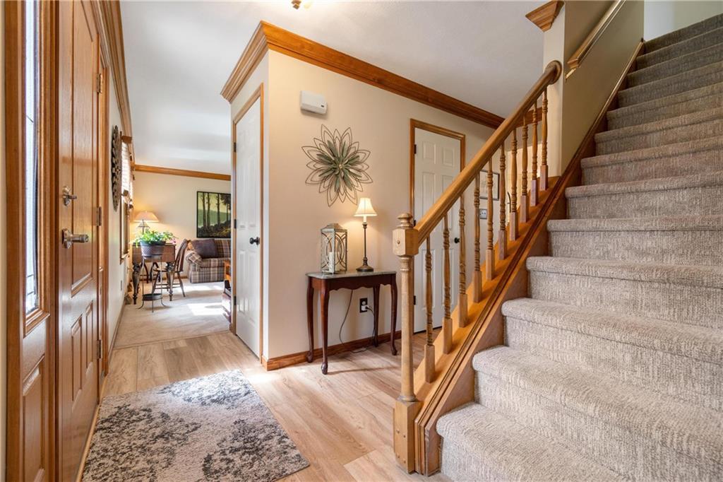 116 Firethorn Road Baden, PA 15005 - Photo 6 of 41 a view of a hallway with wooden floor and staircase