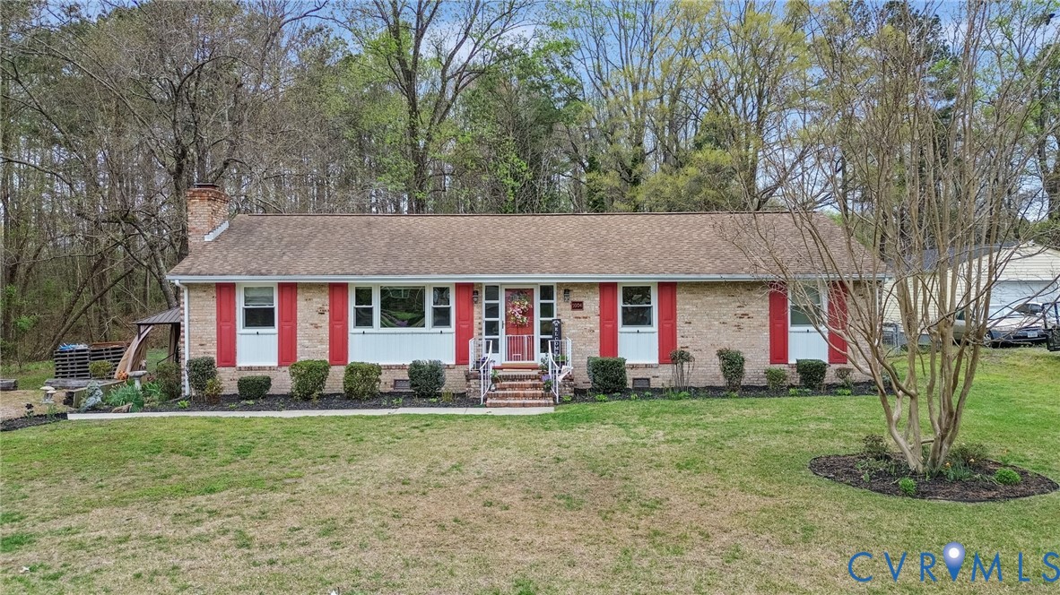 5904 Sutherland Drive Sutherland, VA 23885 - Photo 1 of 20 a front view of house with yard and green space