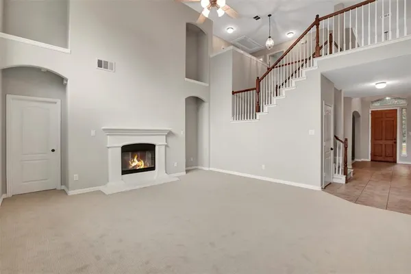 a view of an empty room with a fireplace