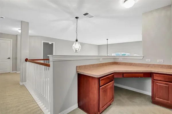 a kitchen with kitchen island a sink stainless steel appliances and cabinets
