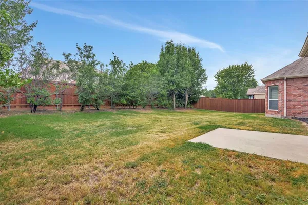 a view of backyard with green space