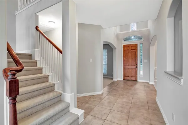 a view of entryway with wooden floor