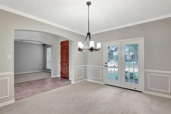 a view of a room with cabinet and entryway