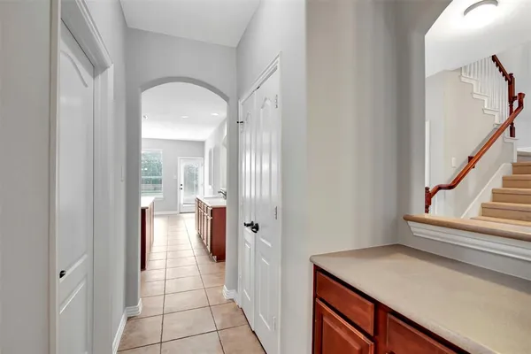 a view of a hallway view with wooden floor and staircase