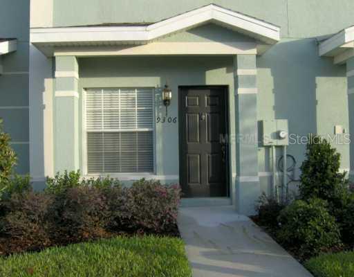 9441 Flowering Cottonwood Road Orlando, FL 32832 - Photo 1 of 1 a front view of a house with a yard