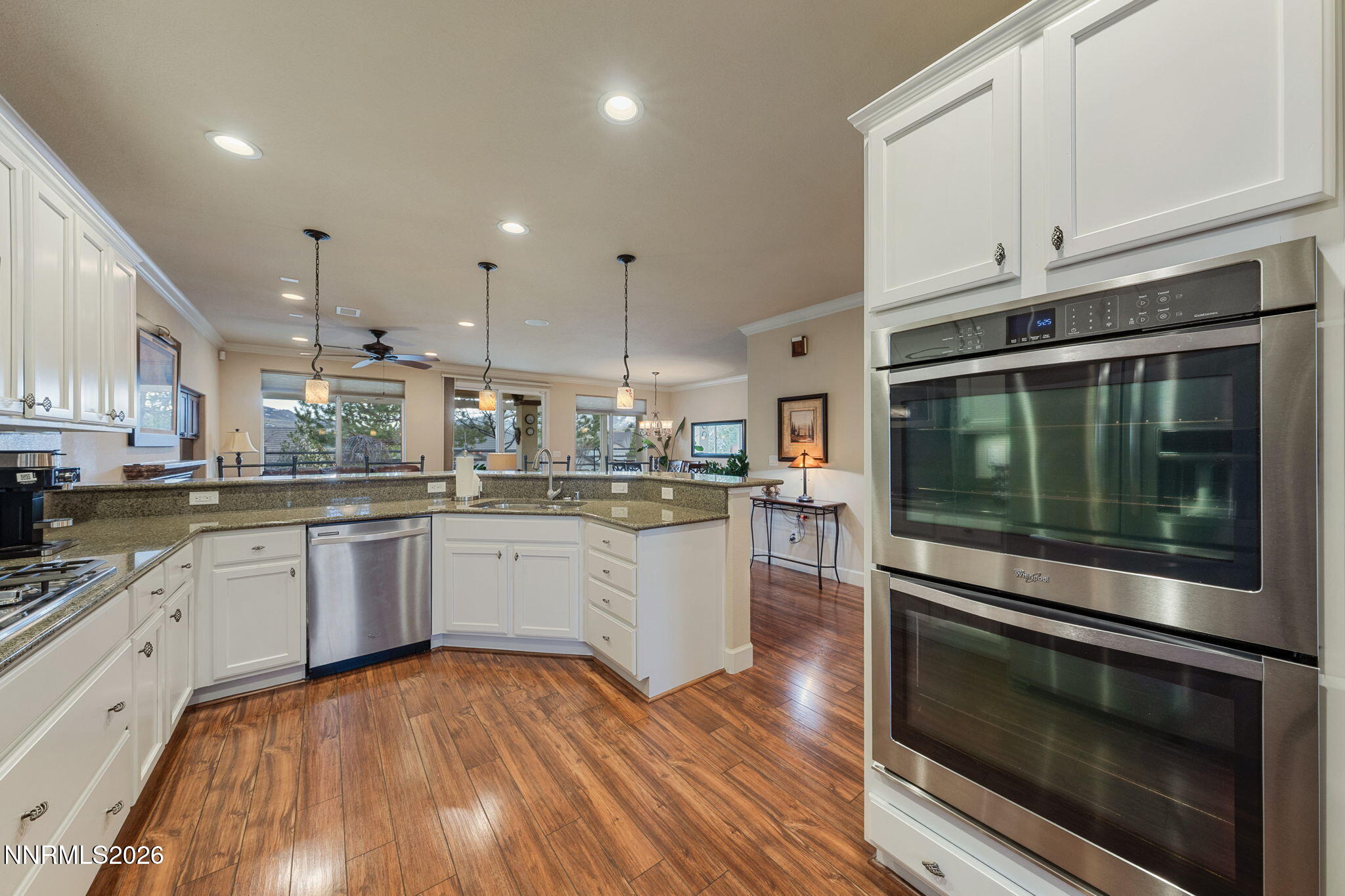 9370 Rockhurst Court Reno, NV 89523 - Photo 13 of 40 a kitchen with a sink stove and white cabinets
