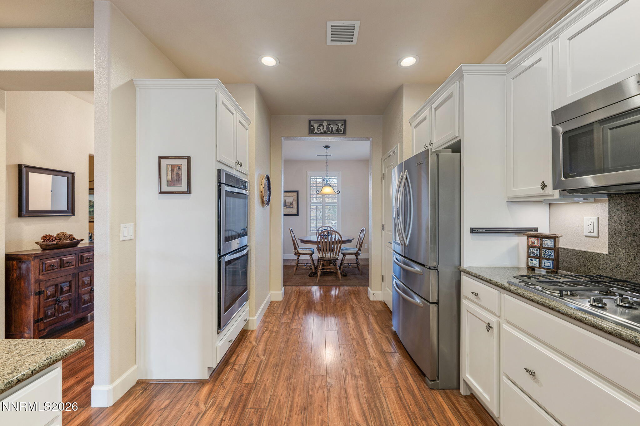 9370 Rockhurst Court Reno, NV 89523 - Photo 18 of 40 a kitchen with stainless steel appliances a refrigerator stove and microwave