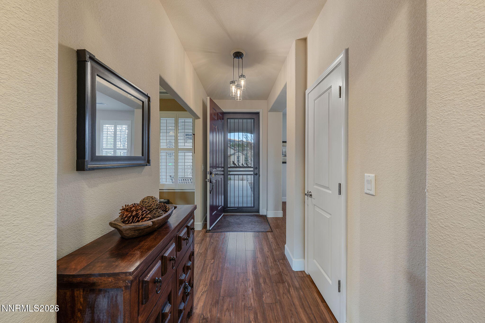 9370 Rockhurst Court Reno, NV 89523 - Photo 24 of 40 a hallway with wooden floor windows and livingroom