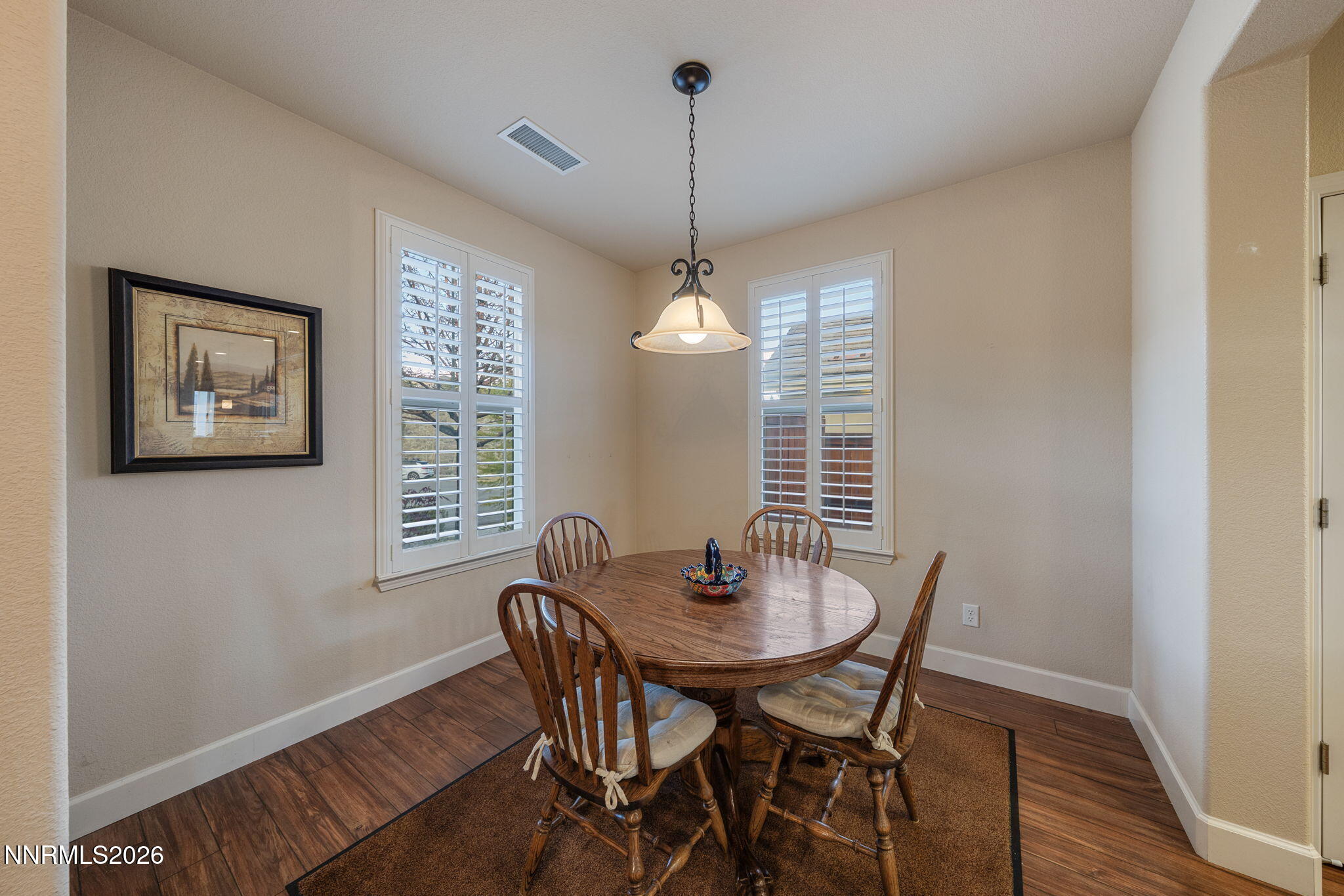 9370 Rockhurst Court Reno, NV 89523 - Photo 25 of 40 a view of a dining room with furniture window and wooden floor
