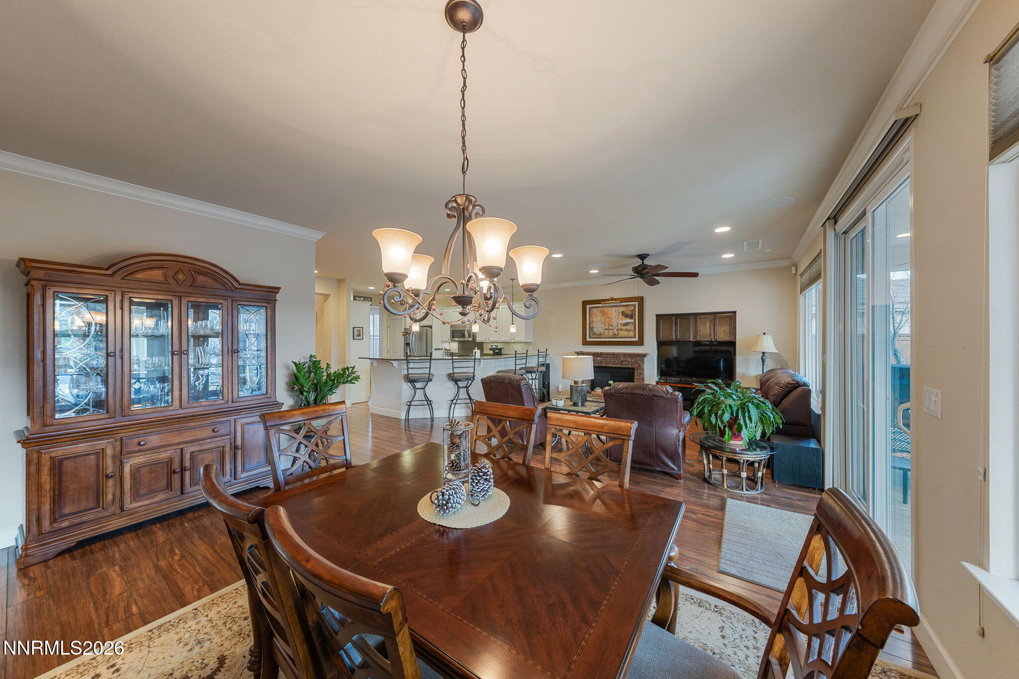 9370 Rockhurst Court Reno, NV 89523 - Photo 26 of 40 a view of a dining room with furniture a chandelier and wooden floor