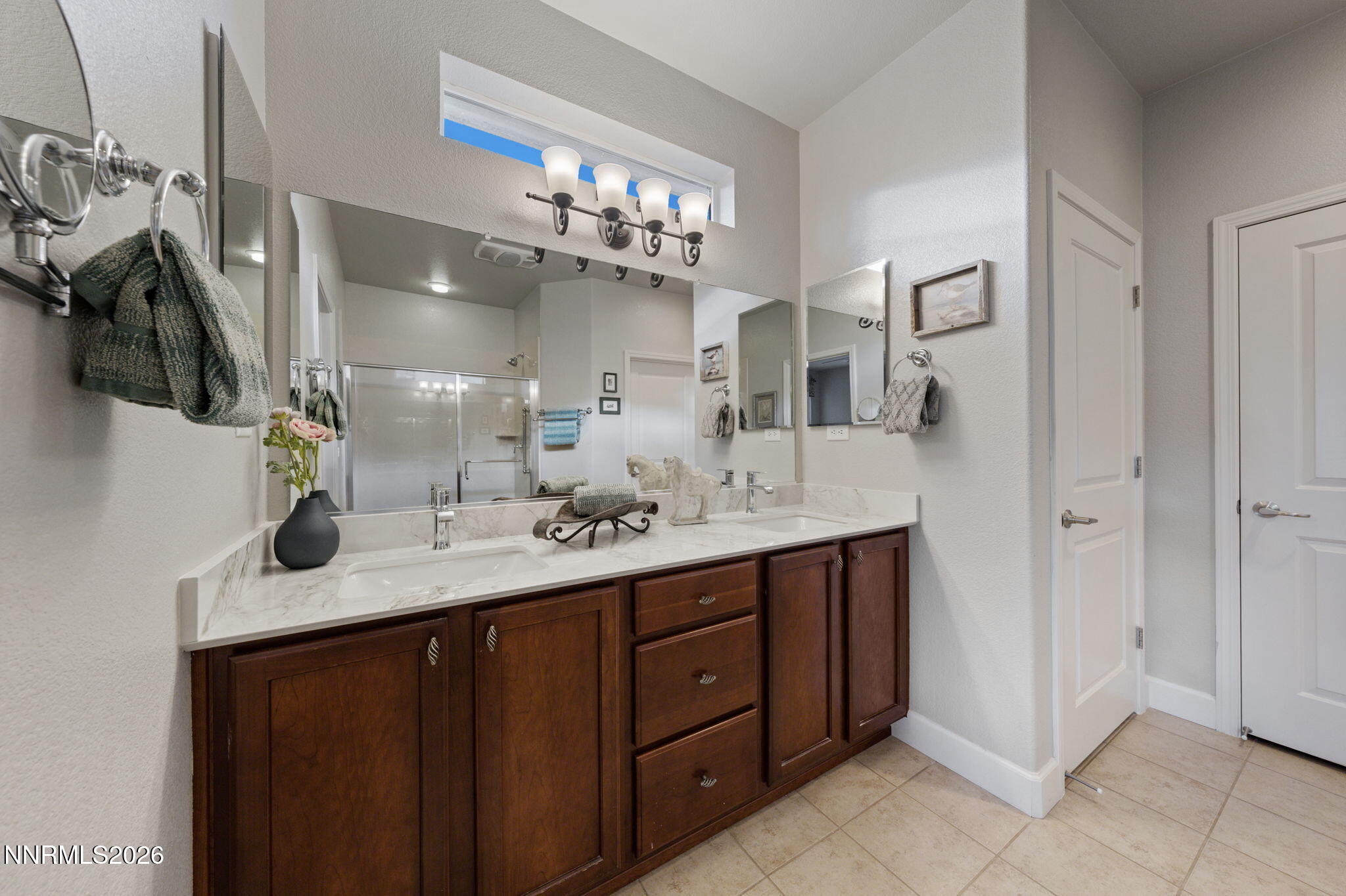 9370 Rockhurst Court Reno, NV 89523 - Photo 29 of 40 a bathroom with a sink vanity and mirror
