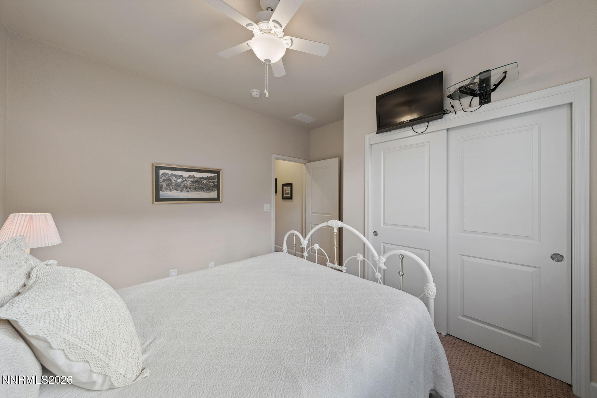 9370 Rockhurst Court Reno, NV 89523 - Photo 32 of 40 a bedroom with a bed and a chandelier