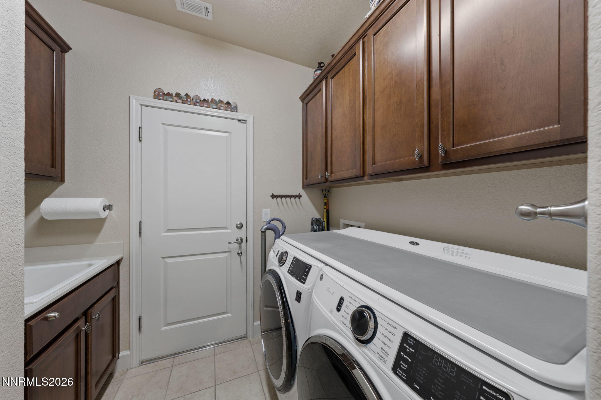 9370 Rockhurst Court Reno, NV 89523 - Photo 34 of 40 a utility room with dryer and washer