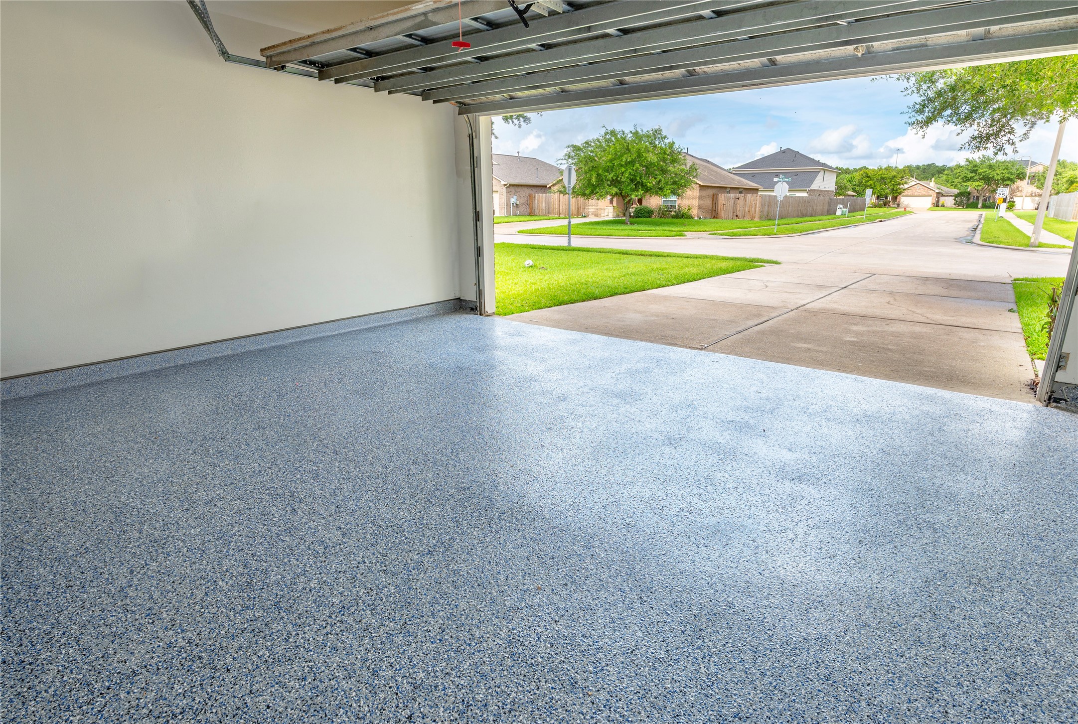 129 Rustic Colony Lane Dickinson, TX 77539 - Photo 22 of 33 New epoxy flooring in the garage