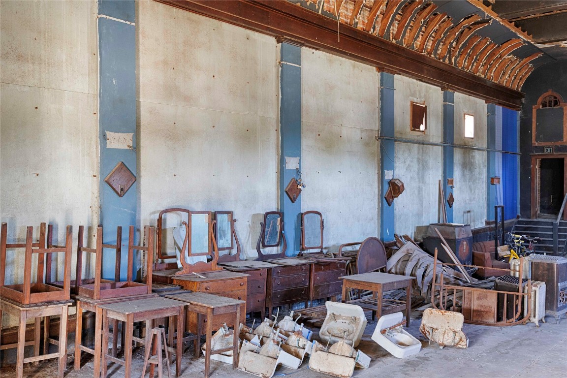 607 Lyons Avenue Schulenburg, TX 78956 - Photo 16 of 27 a dining room with furniture and a chandelier