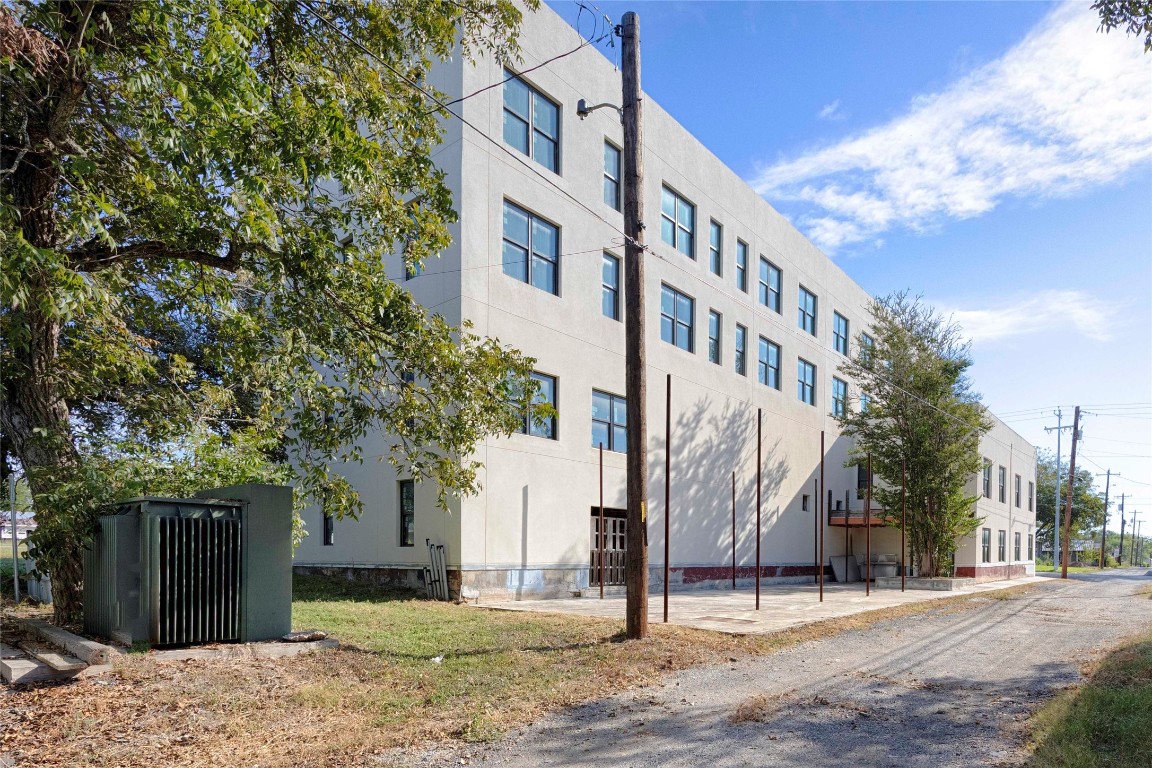 607 Lyons Avenue Schulenburg, TX 78956 - Photo 26 of 27 a view of a building with a tree