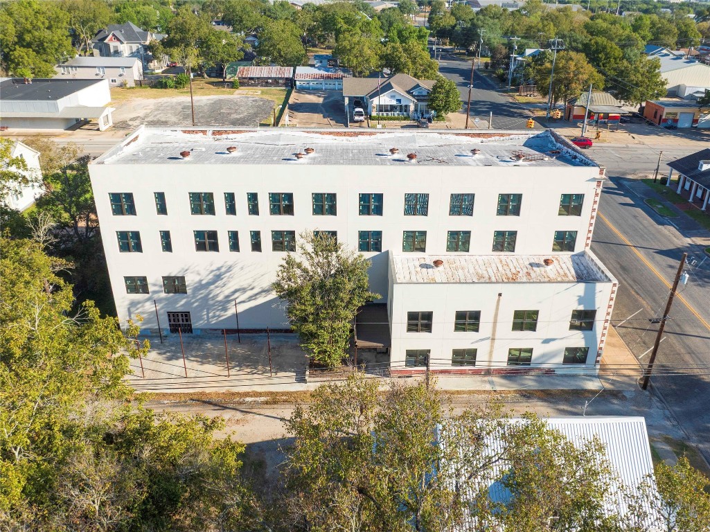 607 Lyons Avenue Schulenburg, TX 78956 - Photo 8 of 27 a view of a building with a yard
