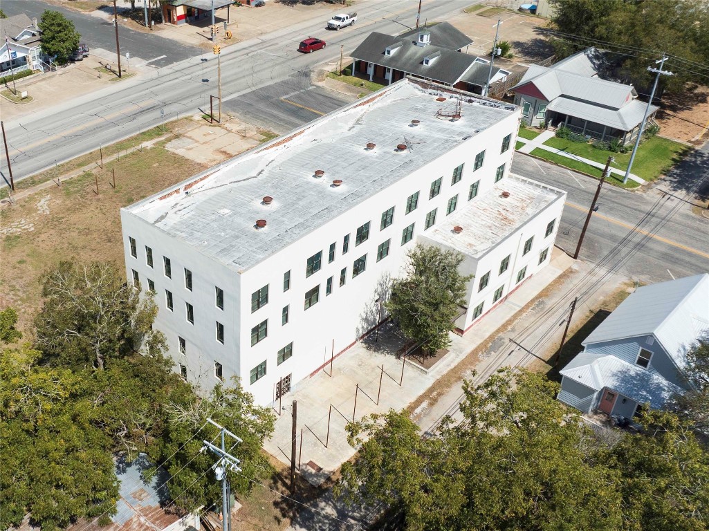 607 Lyons Avenue Schulenburg, TX 78956 - Photo 9 of 27 aerial view of a house with a yard