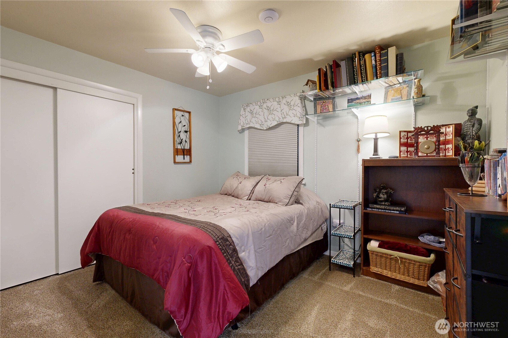 821 East Chestnut Street Walla Walla, WA 99362 - Photo 11 of 39 a bedroom with a bed and a book shelf