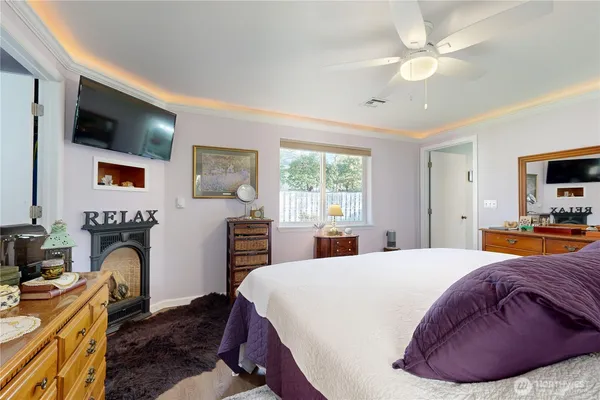 a bed room with bed and mirror