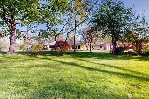 a backyard of a house with lots of green space