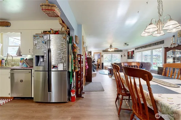 a view of a dining room with furniture window and wooden floor