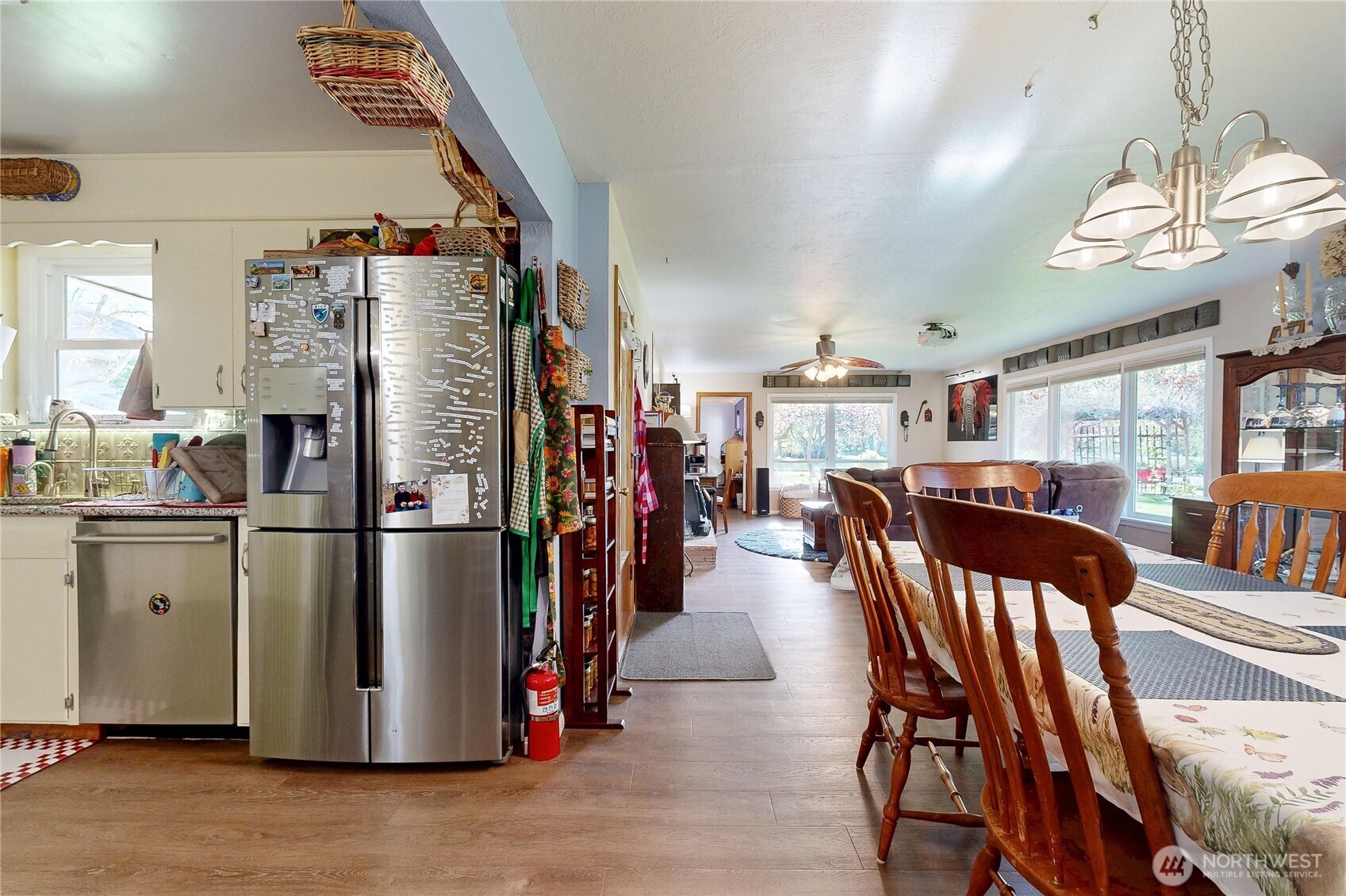 821 East Chestnut Street Walla Walla, WA 99362 - Photo 8 of 39 a kitchen with stainless steel appliances a refrigerator a stove a dining table and chairs