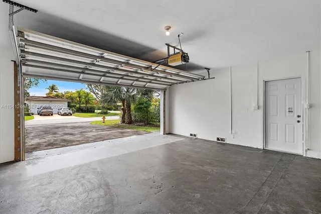 a view of parking and garage