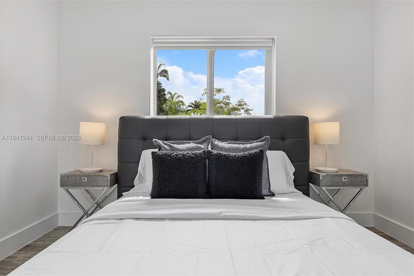 10361 Southwest 119th Street Miami, FL 33176 - Photo 19 of 38 a bed sitting in a bedroom and lamp