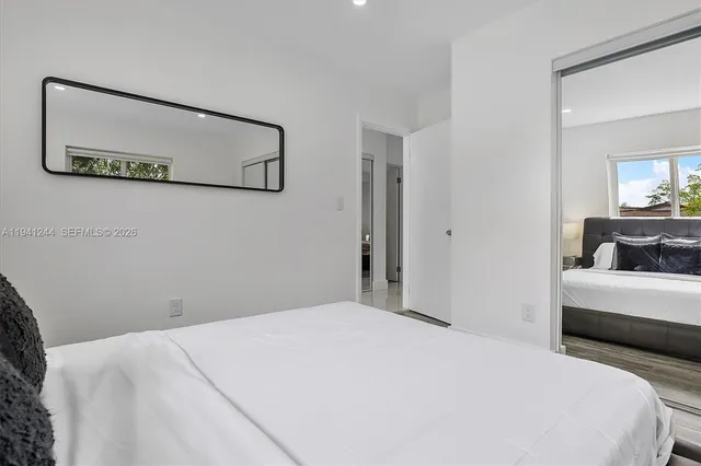 a bedroom with a bed and a couch