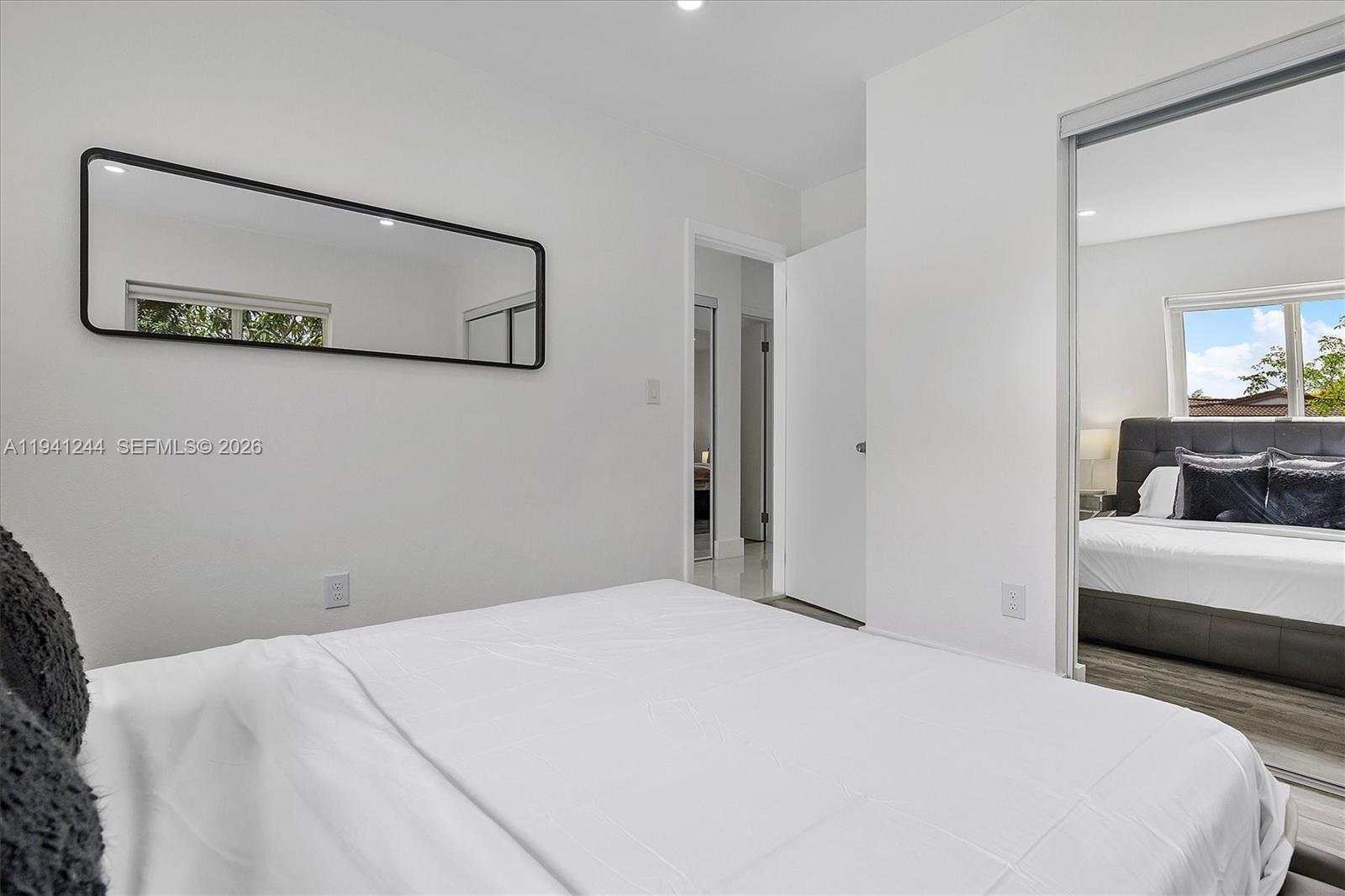 10361 Southwest 119th Street Miami, FL 33176 - Photo 20 of 38 a bedroom with a bed and a couch