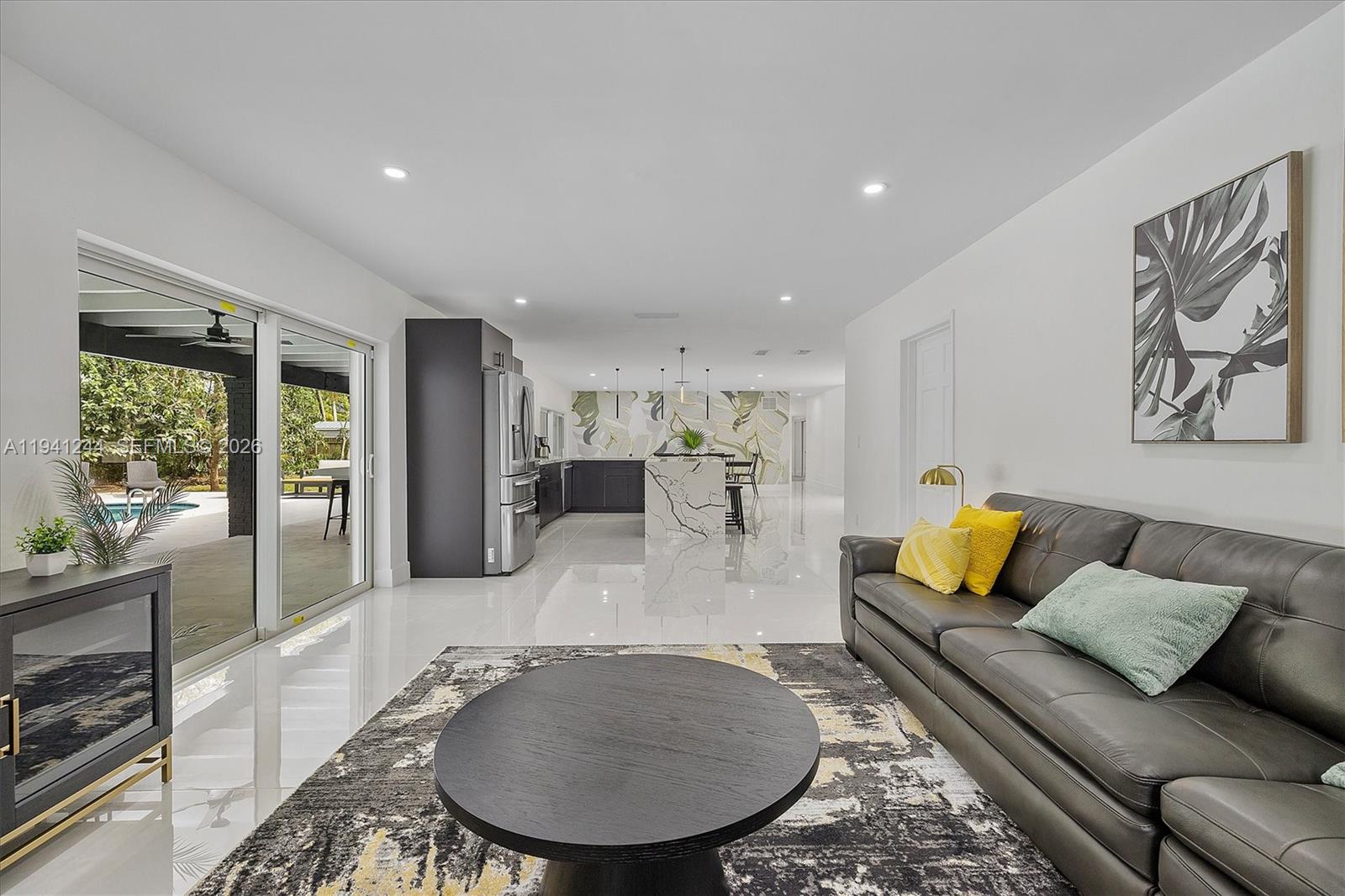10361 Southwest 119th Street Miami, FL 33176 - Photo 22 of 38 a living room with furniture and a table