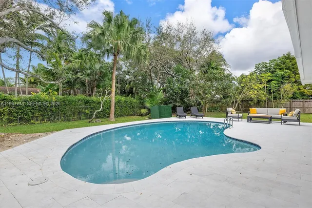 a view of a swimming pool with a patio